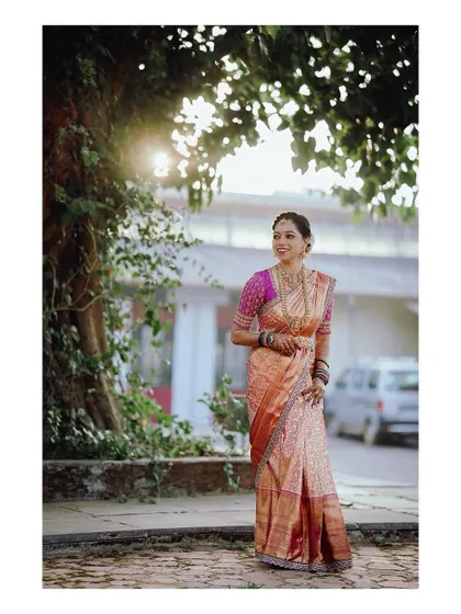 A full shot of the bride in her gorgeous wedding attire, a custom creation.