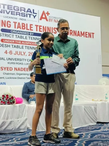 Pehel Gupta, who won double gold medals in the U-13 and U-15 Girls categories, receiving one of her awards at the UP State Ranking Tournament in Lucknow.