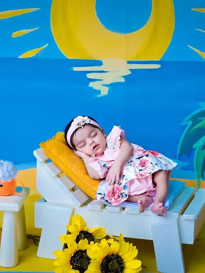 A fun and colorful beach vacation theme, complete with a tiny lounge chair, sunny backdrop, and miniature props.