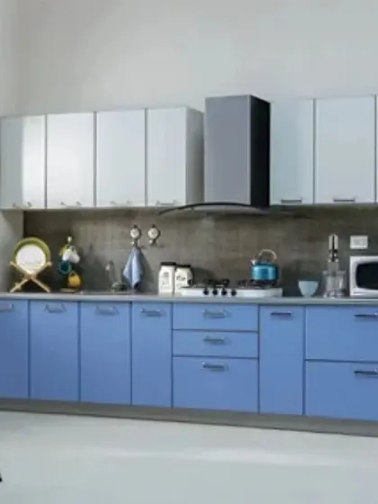 A simple and clean straight kitchen layout. The combination of light blue lower cabinets and white uppers creates a fresh and airy feel, perfect for smaller homes.