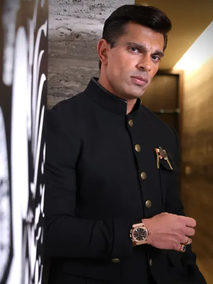 Karan Singh Grover in a sleek, modern setting. This portrait highlights his sharp style and confident presence.