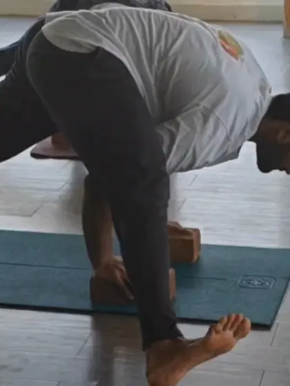 Balancing poses are fundamental in our TTC. A student practices a variation of a standing balance, demonstrating the focus and control that are hallmarks of an advanced practitioner.