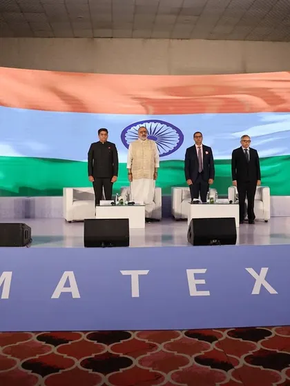 Standing on stage for the national anthem at the MATEXIL awards, alongside esteemed guests. I am meticulous about following event protocol.