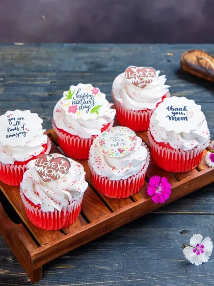 A box of our special Mother's Day Red Velvet Cupcakes. Each cupcake is topped with a sweet, heartfelt message for Mom.