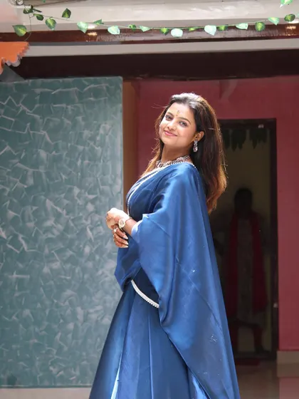 Sonu looking elegant during an inauguration event, wearing our custom-designed blue Langa Dhawani.