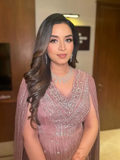 Nikita looks absolutely radiant. The makeup is designed to be photogenic and make her feel her best.