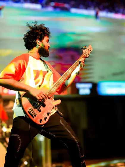 Our bassist laying down a heavy groove, completely absorbed in the music. The foundation of our powerful sound.