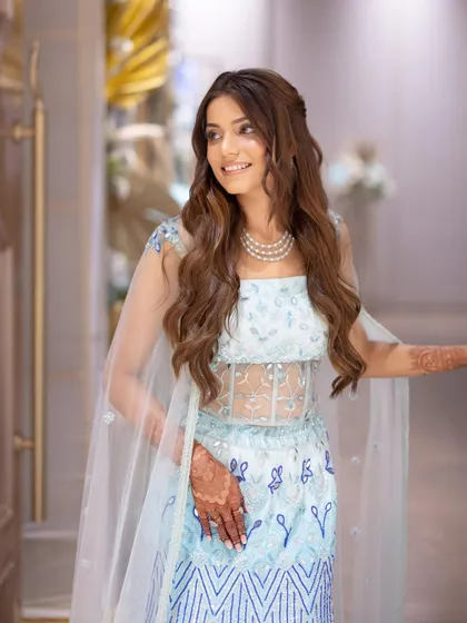 Another gorgeous shot of Rashi's engagement look. The soft waves in her hair and the radiant makeup give her a modern fairytale vibe.