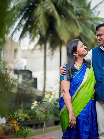 A lovely outdoor portrait of a couple taking a stroll, sharing a look of love and companionship. Perfect for celebrating an anniversary.