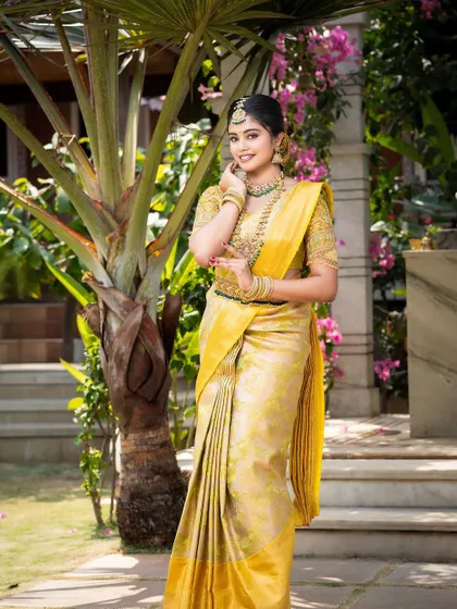 A full-length shot of the model, her traditional attire and jewellery creating a stunning visual.