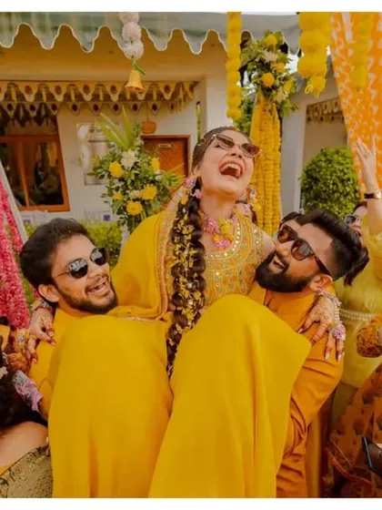 Pure, uninhibited joy. This shot of the bride, Yashika, being lifted by her friends during the Haldi ceremony is a perfect example of the candid, high-energy moments I love to capture.