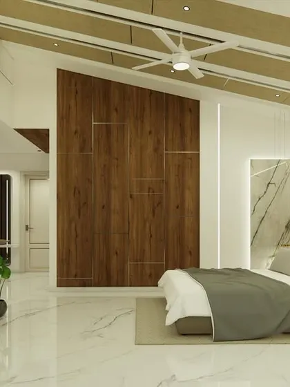 The master bedroom in "Yash Villa" features a sloped ceiling with wooden rafters and a dramatic marble-clad wall behind the bed.