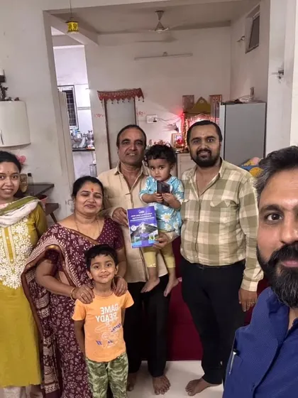 A family with young children poses with our team, excited about their new solar journey. We are building a cleaner world for the next generation.
