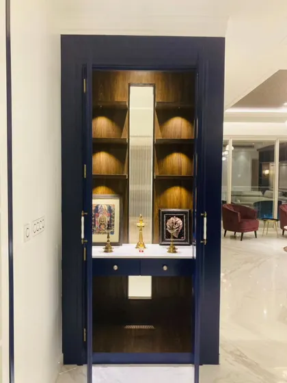 This Pooja cabinet is truly shelf-conscious! A modern and elegant prayer unit in deep blue with integrated lighting and storage.
