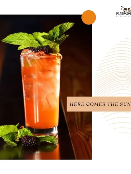 Here comes the sun with a refreshing tequila cocktail. This image showcases a beautiful blackberry and mint tequila drink, perfect for beating the heat.