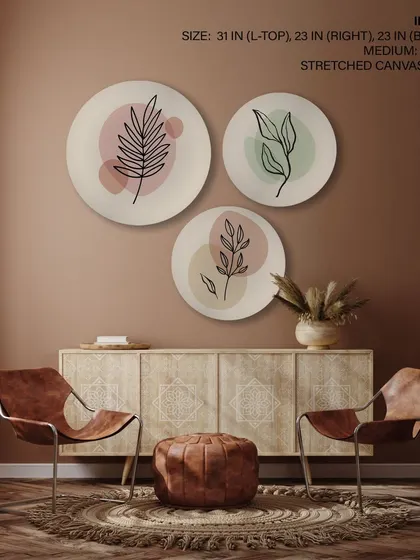 A serene set of three circular stretched canvas prints with minimalist leaf drawings. The soft, abstract color backgrounds create a peaceful and contemporary botanical theme.