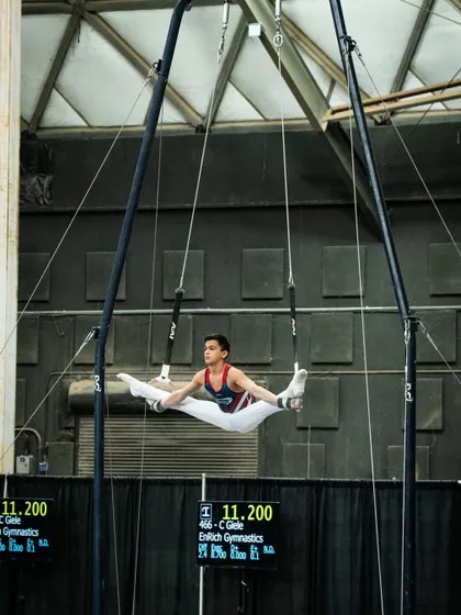 This is what dedication looks like! Here's one of our advanced athletes, Zachary, demonstrating incredible strength and form on the still rings during a national competition. We train gymnasts to reach their highest potential.