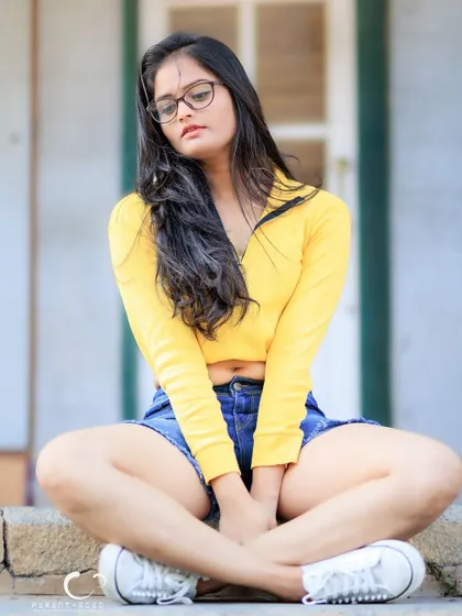 A pensive and thoughtful version of the seated pose. This shows how a simple change in expression can alter the mood of a portrait.