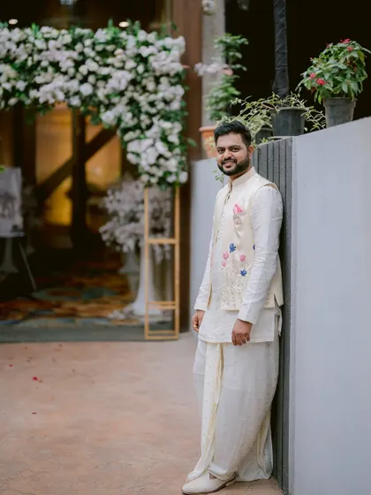 A dapper portrait of the groom, Saurabh, looking sharp in his traditional attire.