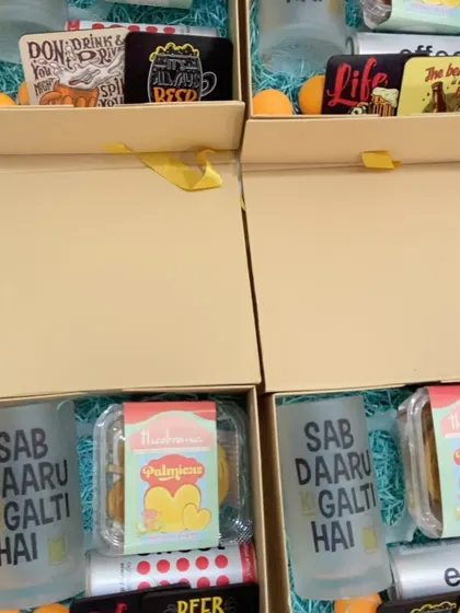 A fun and quirky corporate gift hamper with beer-themed mugs and snacks, perfect for a relaxed company event or celebration.