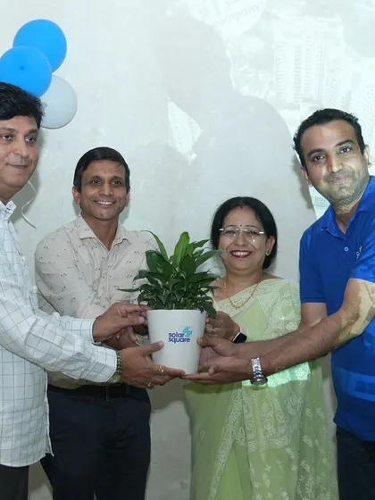 Our team presenting a green plant to the committee members of Infinity Society, symbolizing our shared commitment to a sustainable future.