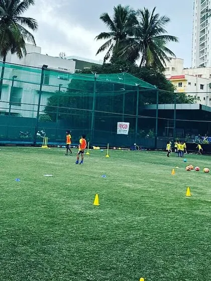 A wide view of our training ground with players engaged in various drills. We have the space and equipment to run effective, large-group sessions.