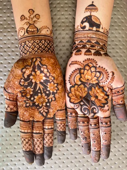 Short but stunning. This designer mehendi combines floral patterns with an elephant motif.