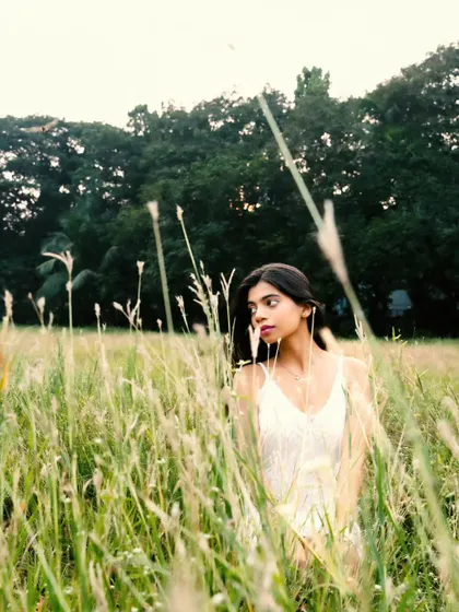 Peeking through the tall grass, this shot feels intimate and connected to the natural surroundings.