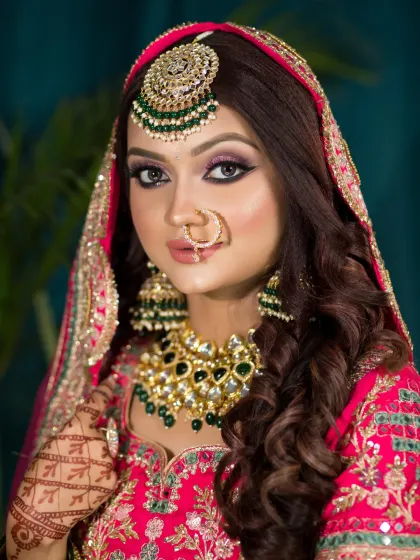 A vibrant and glamorous look in a hot pink lehenga. I used a dramatic winged liner and bold lashes to make her eyes the centerpiece of this stunning bridal makeup.