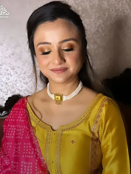 A close-up of a very natural and elegant makeup look. The eyeshadow is a simple wash of bronze, and the skin looks fresh and healthy.