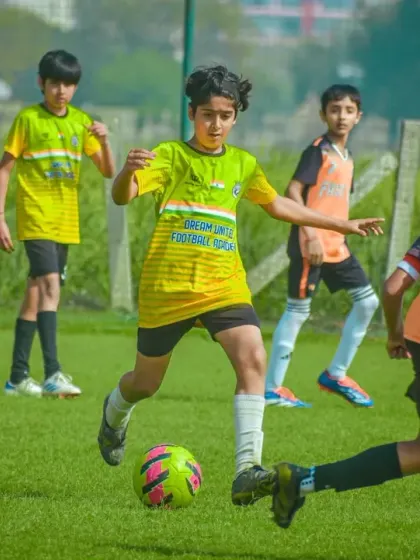 Dribbling through a crowded midfield, this player shows great balance and vision.