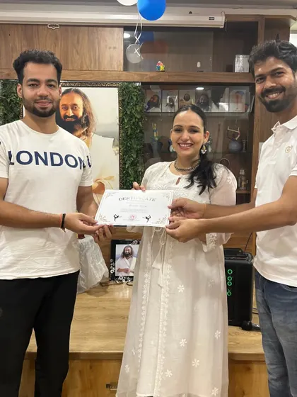 Another member of the "Yog Mitra" team is awarded his certificate. Our events are a testament to the strong community we've built.