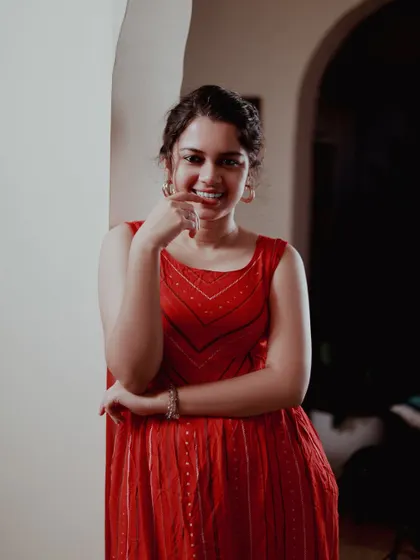 A playful and sweet expression. It's important to have a variety of emotions in a portfolio, and this shot adds a touch of lightheartedness.