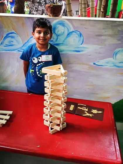 Even with a cast on his arm, this young builder was determined to create. It shows that the desire to build is powerful. He is exploring patterns and balance, proving that everyone can participate and achieve something they are proud of.