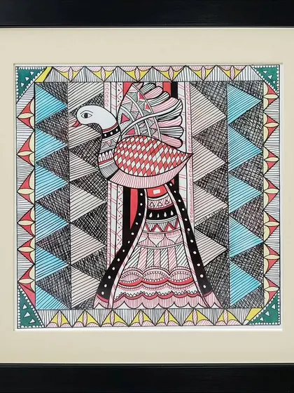 A Madhubani painting by Vrishti featuring a bird with intricate geometric patterns on its wings and body. The use of contrasting colors and detailed line work is characteristic of this traditional art form.
