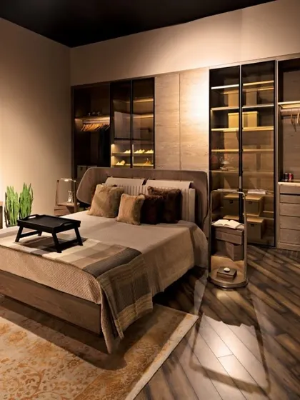 This premium bedroom setting is finished in warm, neutral tones using a combination of succupira veneer and brass matt highlights. The leather upholstery on the bed and study chair adds a layer of timeless sophistication to the cozy environment.
