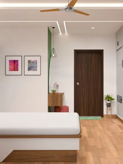 This bedroom combines a wood-paneled wall behind the bed with a soft green accent wall. The design includes a wall-mounted TV and a comfortable armchair, creating a multi-functional space.