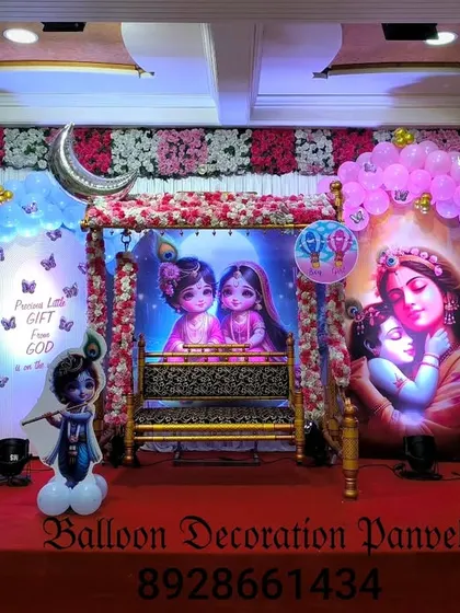 For a larger Dohale Jevan or baby shower event, I can create a full stage decoration. This one featured a beautiful Krishna theme with a decorated cradle, balloon arches, and character cutouts, creating a divine atmosphere for the mother-to-be.