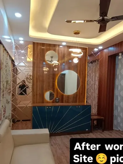 Another angle of the finished living room, showing how the different elements like the TV unit, sofa, and false ceiling come together to create a cohesive and beautiful space.