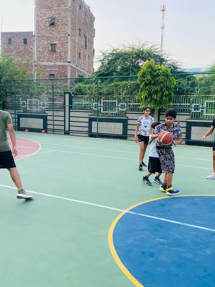 A young player practices his dribbling.