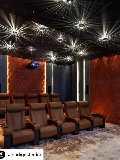 Entertainment zones are about creating an immersive experience. For this private home theatre, we designed a starlit ceiling and used plush, comfortable seating and acoustically treated wall panels to build a luxurious, cinematic escape right at home.