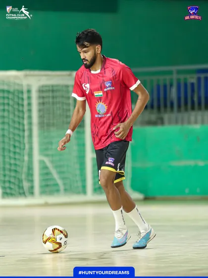 A player focused on his ball work during the warm-up.