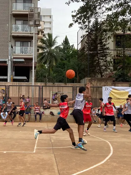 A player goes airborne for a contested layup during the finals. This is the kind of high-flying action you can expect at our tournaments.