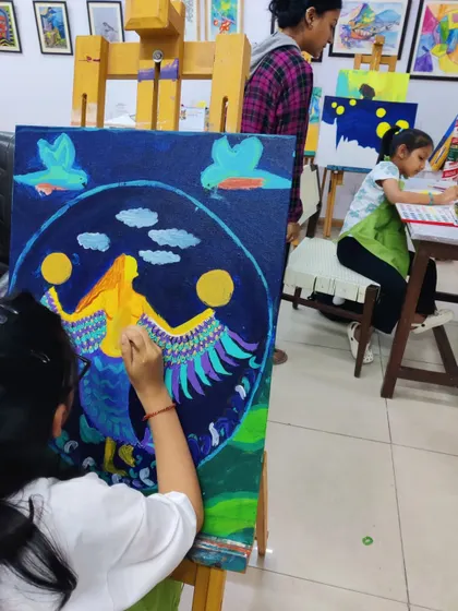 These images document the creation of a whimsical mermaid painting, showing the layering of colors and development of the composition.