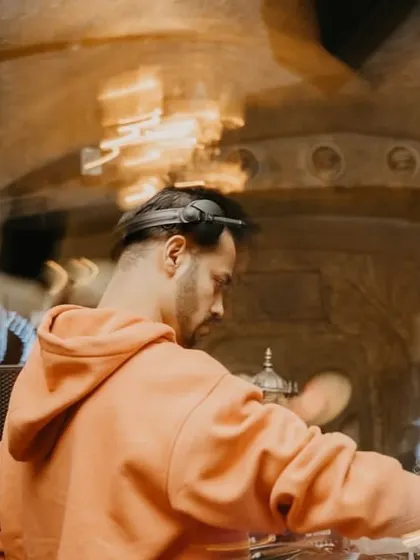 A motion-blur photo from the back, capturing the movement and energy of a live performance.