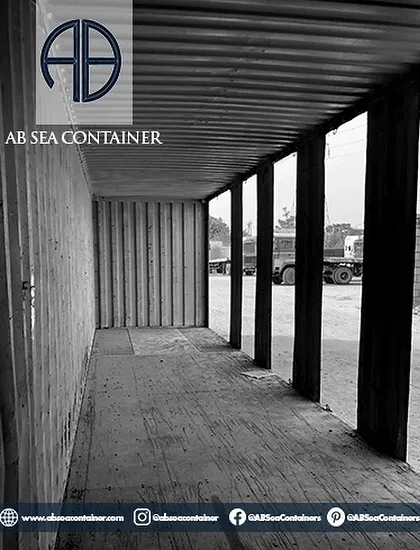 This shot shows the raw interior of a container with its side panels removed, creating an open-air corridor. This is an early step in creating structures with verandas or open-concept layouts.