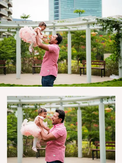 A father joyfully lifts his daughter into the air in a beautiful park setting. These playful, candid moments create the most authentic family portraits.