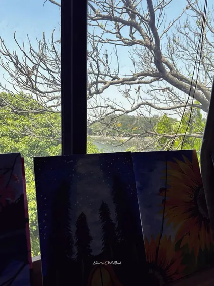 A beautiful view from our lake-facing studio in Bangalore. The serene backdrop provides the perfect inspiration for a creative session.