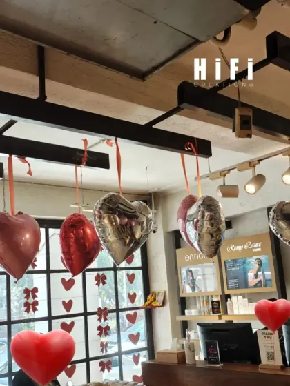 The Valentine's decorations seen from behind the reception desk. The decor is visible from the large front windows, helping to attract customers and communicate the seasonal promotion.