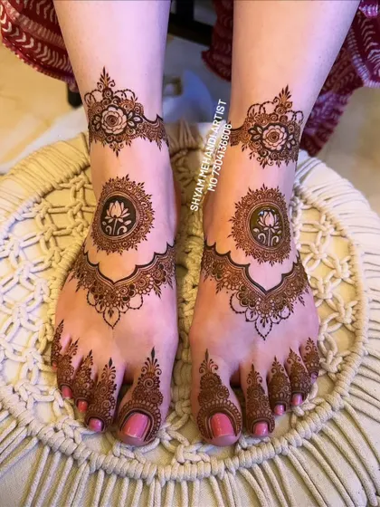 The completed lotus mandala design with a rich, dark henna stain, ready for a special occasion.